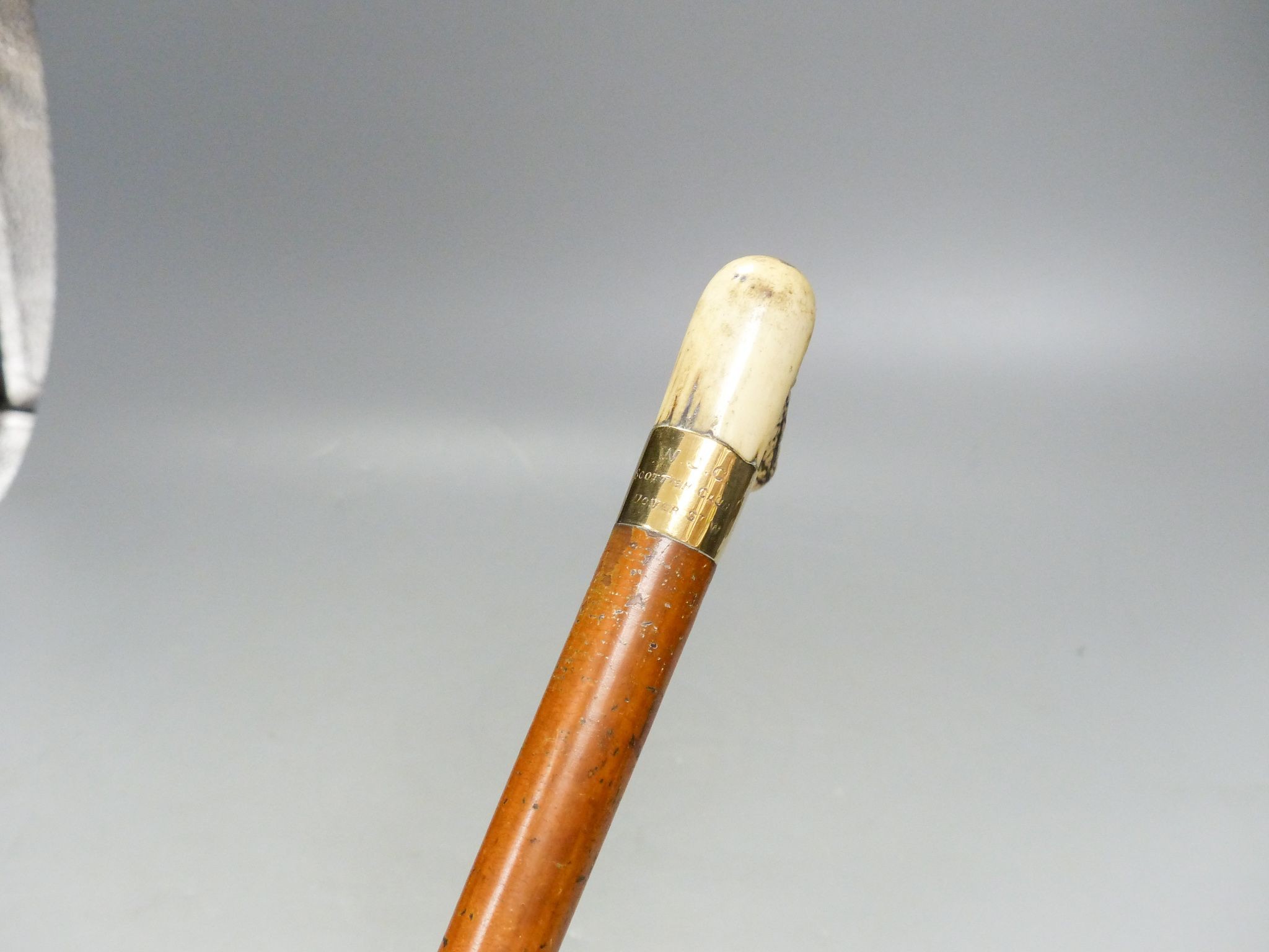 A Victorian 9ct gold mounted cane with antler handle 84cm